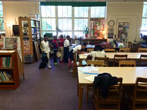 students checking out books