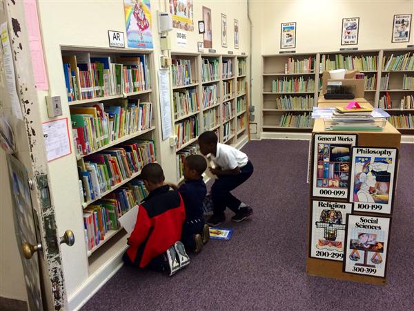 students browsing non-fiction shelves