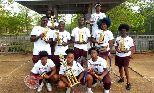 Team members with trophies. 