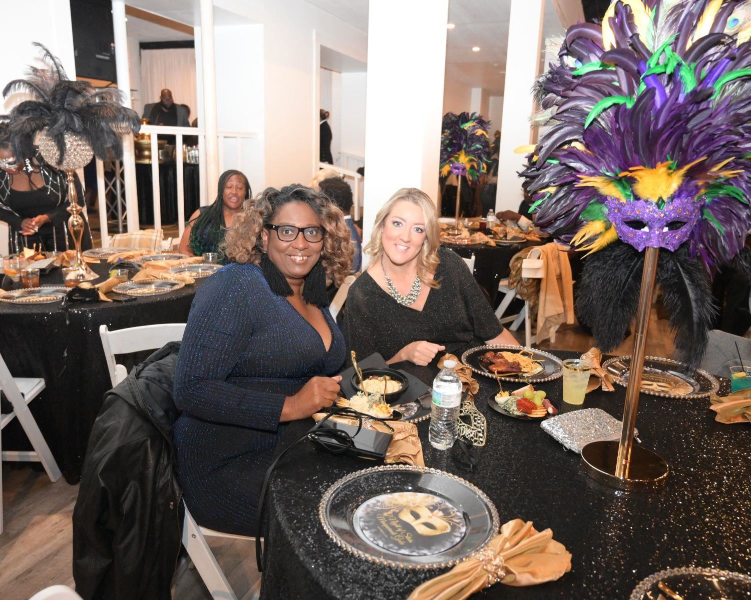 Women smiling at table