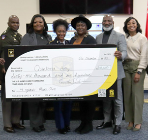  Senior Quintoria Holley and presenters of the full-ride scholarship