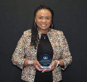 Dr. Shemeka McClung holding JPS Administrator of the Year Plaque