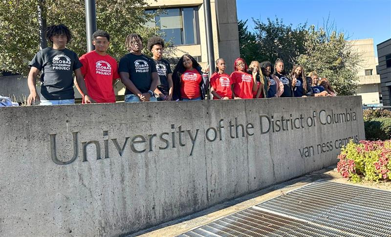 Students behind name stone of University of District of Columbia